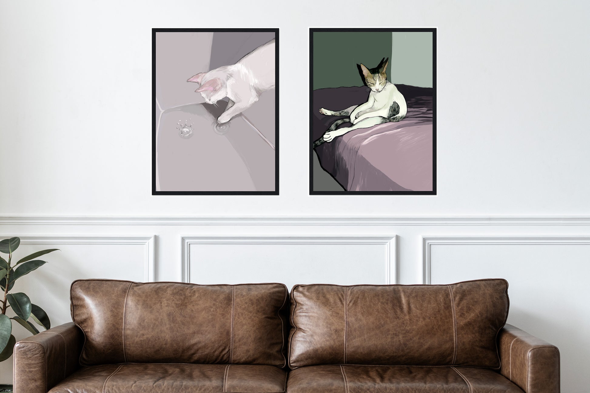 A mockup featuring two framed digital paintings as posters by Neta Singer. The first painting is titled 'The Cat and the Drop', featuring a white cat playing with a water drop in a gray space. The second painting, titled 'Lazy Cat', depicts a cat sitting with its eyes closed. Both paintings are hanging on a wall next to each other, with a brown sofa and a plant visible in the background.